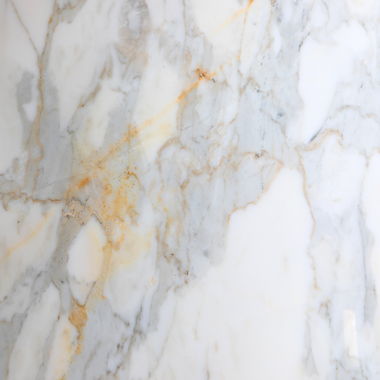 White and gold veined honed marble close-up detail
